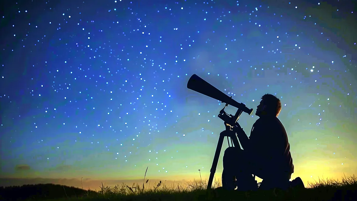 A telescope aimed at a star-filled night sky from a quiet back garden.